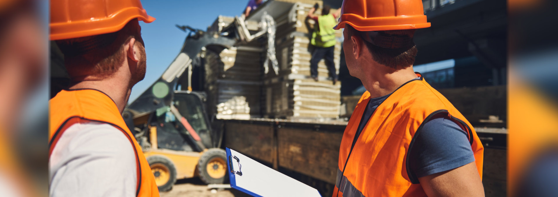 two workers turning their heads and looking at the coworkers