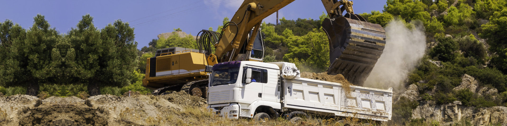 white truck collecting soil